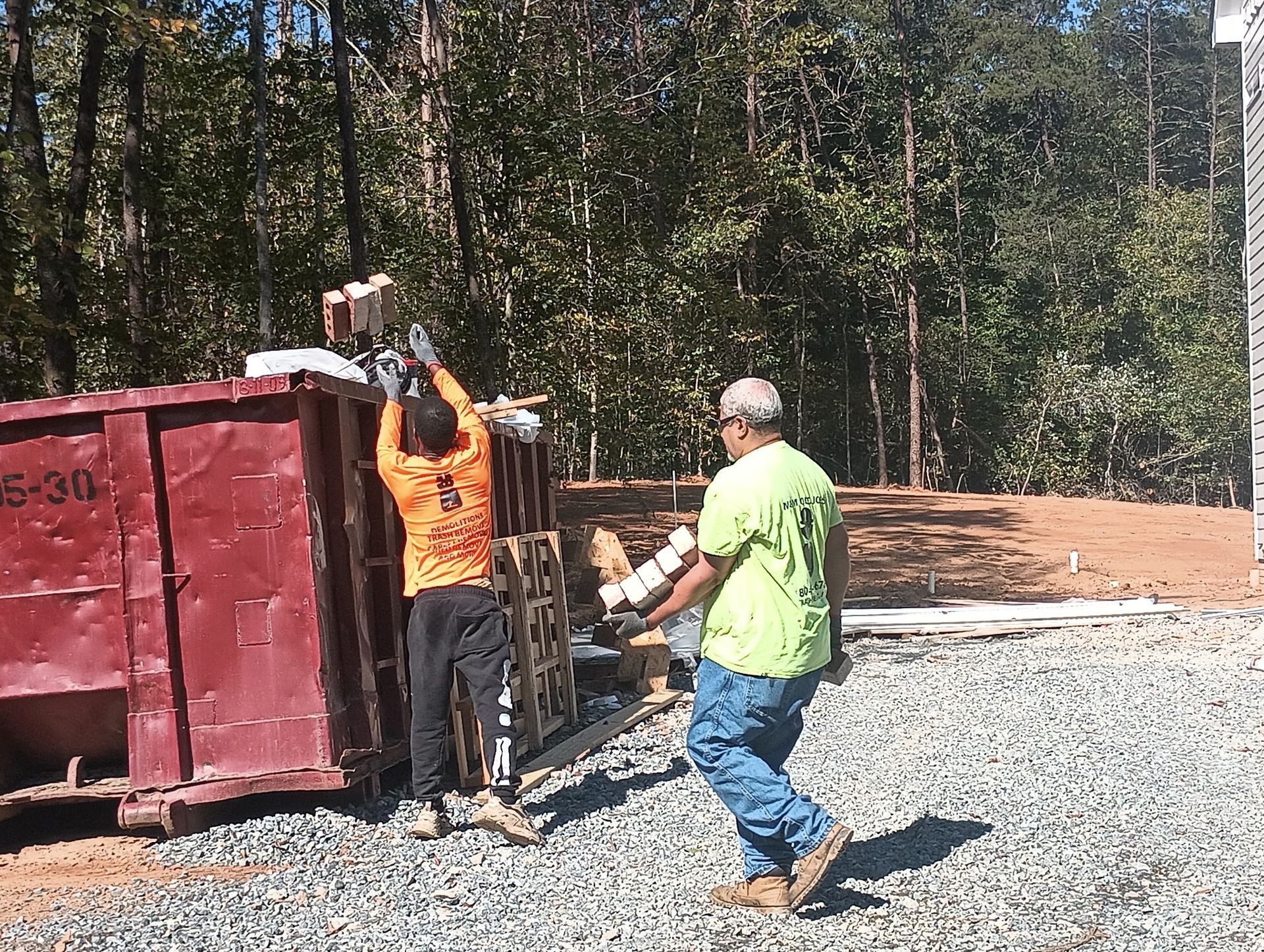 Crew performing site clean up, restocking material and junk removal